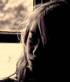 Sad girl in window